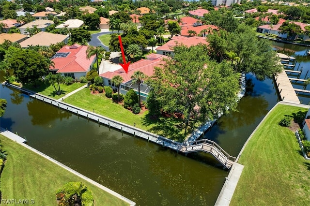 birds eye view of property featuring a water view