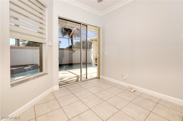 tiled spare room featuring ornamental molding