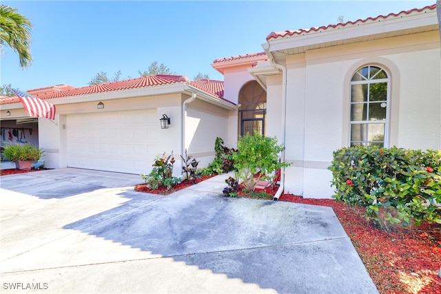 mediterranean / spanish house featuring a garage