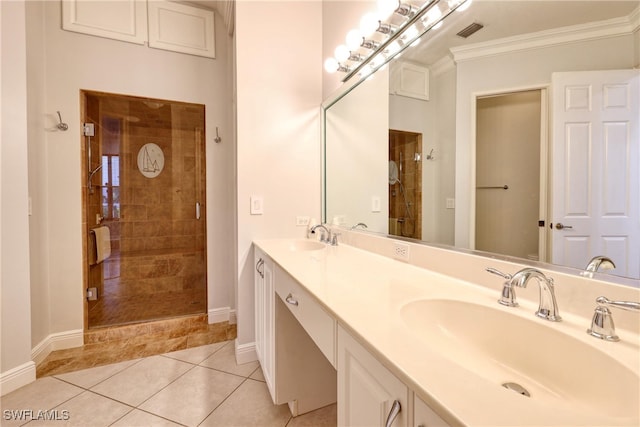 bathroom featuring tile patterned flooring, vanity, ornamental molding, and walk in shower