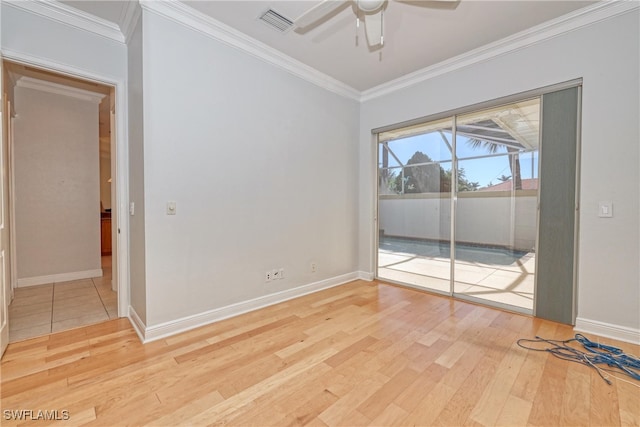 empty room featuring ceiling fan, ornamental molding, and light hardwood / wood-style floors