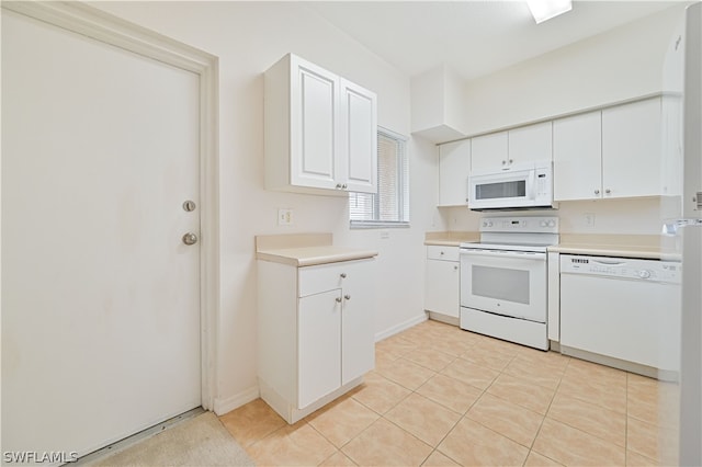 kitchen featuring white cabinets, white appliances, and light tile patterned floors