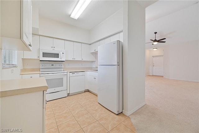 kitchen with white cabinetry, ceiling fan, white appliances, light colored carpet, and lofted ceiling