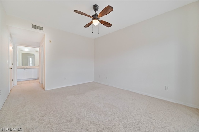 unfurnished room with light carpet and ceiling fan