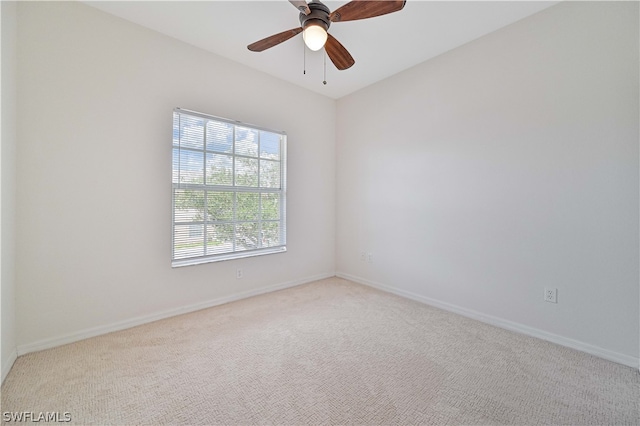 carpeted empty room with ceiling fan