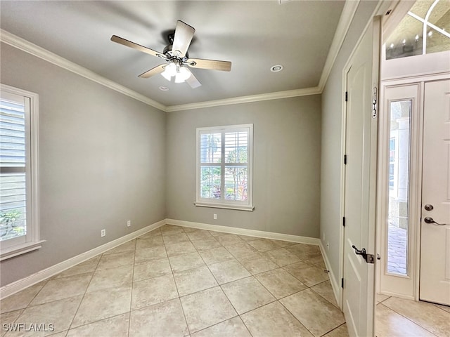 foyer entrance with ceiling fan, ornamental molding, and light tile patterned floors