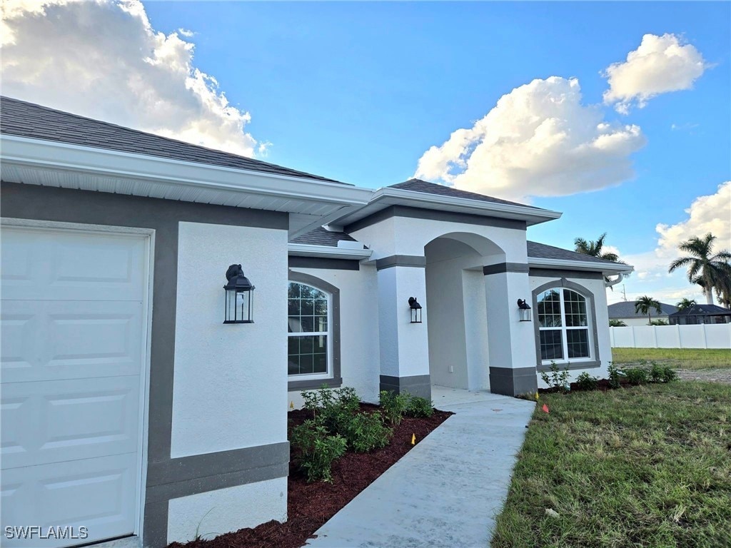 entrance to property featuring a garage