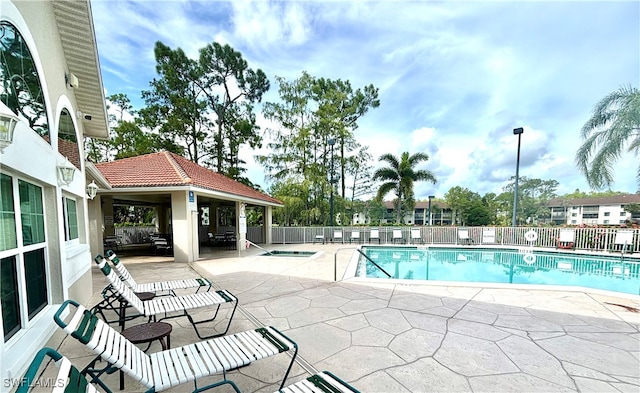 view of pool featuring a gazebo, a hot tub, and a patio area