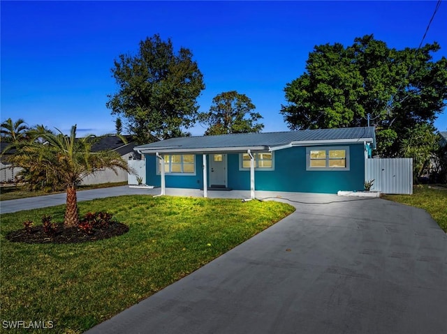 ranch-style home featuring a front yard