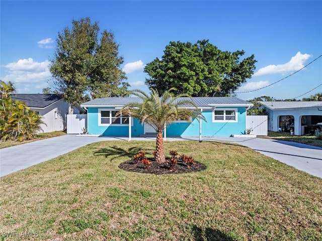 single story home featuring a front yard