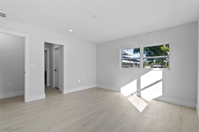 unfurnished room featuring light hardwood / wood-style flooring