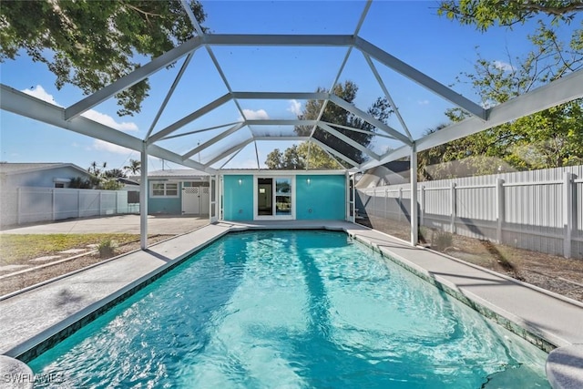 view of pool with a lanai and a patio