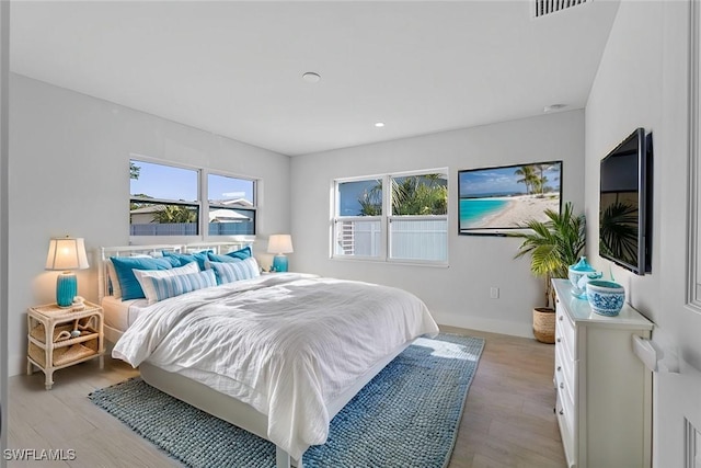 bedroom with light hardwood / wood-style flooring