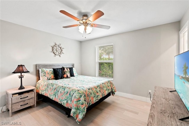 bedroom featuring ceiling fan and light hardwood / wood-style floors