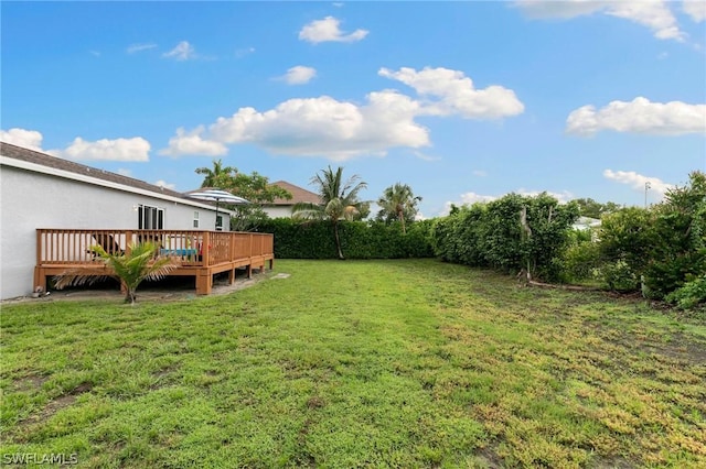 view of yard featuring a deck