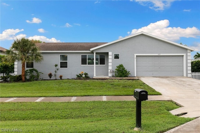 ranch-style house featuring a garage and a front yard