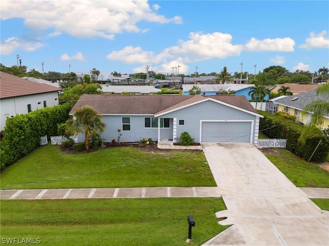 view of front of house with a garage and a front yard