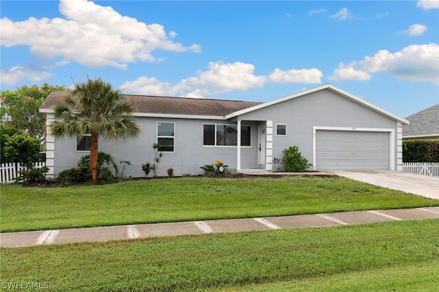 single story home featuring a garage and a front lawn