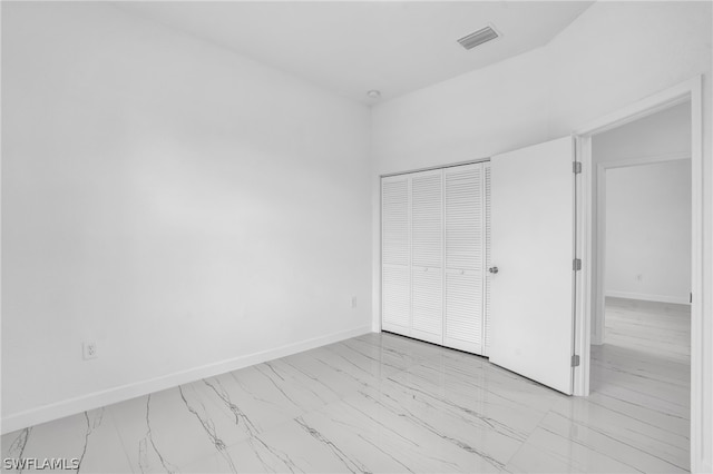 unfurnished bedroom featuring a closet