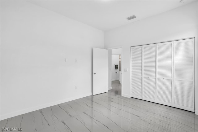 unfurnished bedroom with a closet