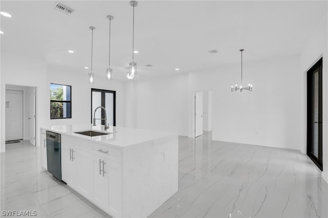 kitchen featuring white cabinets, an island with sink, pendant lighting, sink, and stainless steel dishwasher