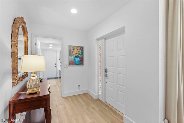 foyer entrance with light hardwood / wood-style flooring