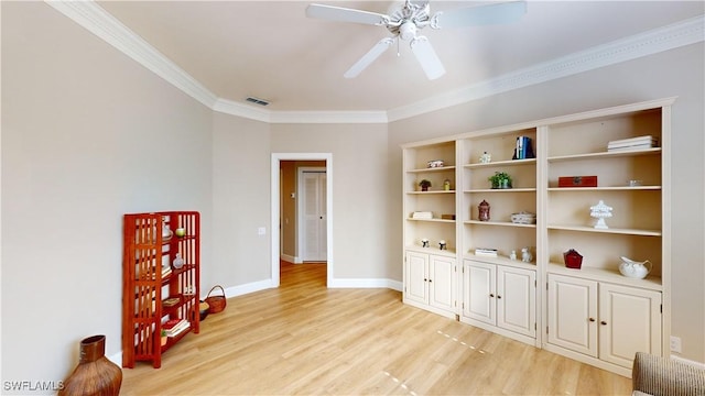 interior space with ceiling fan, crown molding, and light hardwood / wood-style flooring