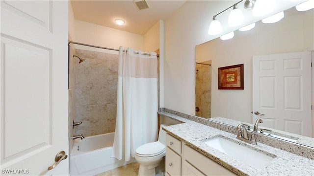 full bathroom featuring shower / bath combination with curtain, vanity, toilet, and tile patterned floors