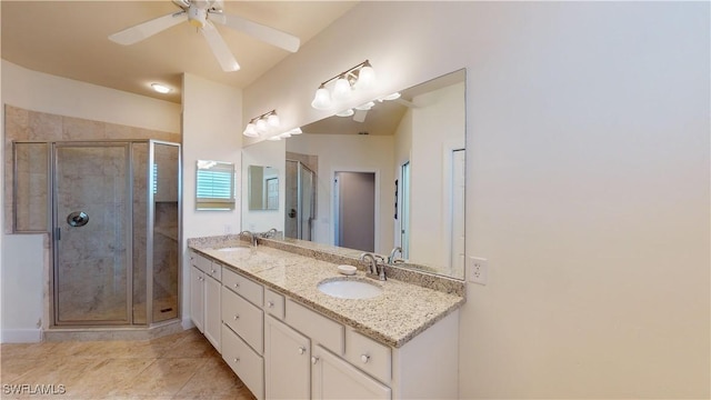 bathroom featuring tile patterned flooring, ceiling fan, an enclosed shower, and vanity