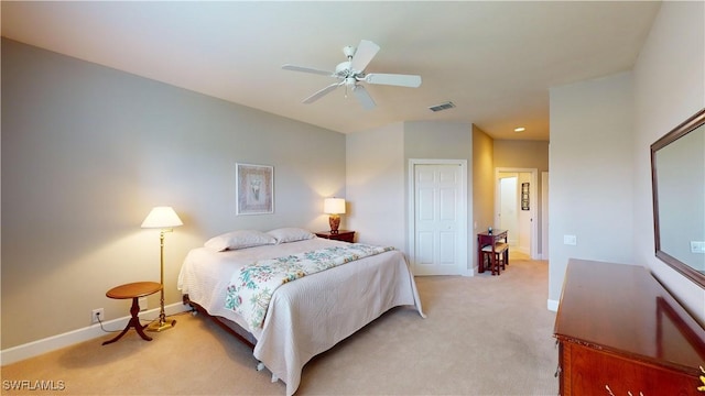 carpeted bedroom featuring a closet and ceiling fan