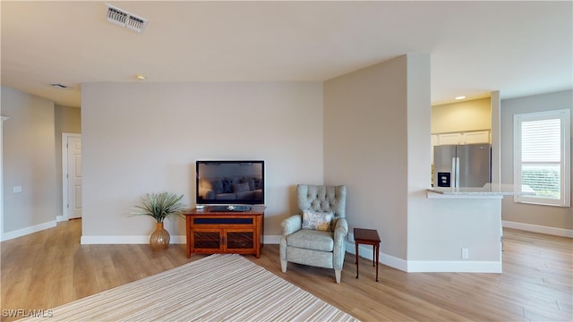 sitting room with light wood-type flooring