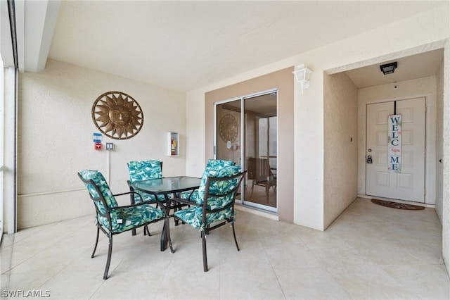 dining area with light tile patterned flooring