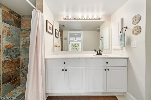 bathroom with double vanity and tile patterned flooring