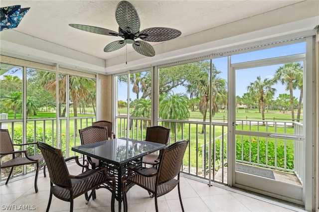 sunroom with plenty of natural light and ceiling fan