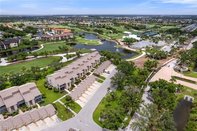 drone / aerial view featuring a residential view and a water view