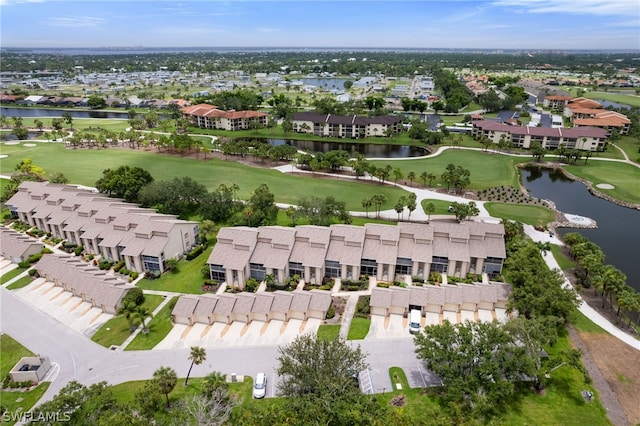 bird's eye view featuring view of golf course, a water view, and a residential view