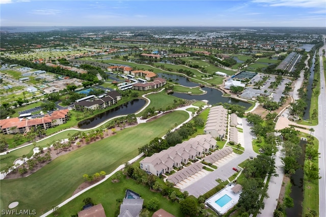 birds eye view of property with a water view and a residential view