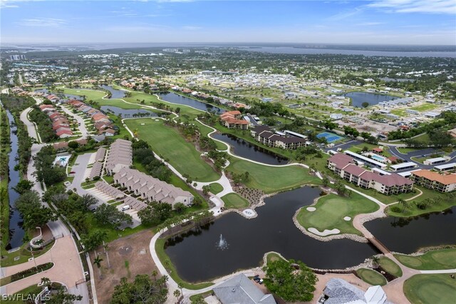 drone / aerial view featuring a water view, a residential view, and golf course view