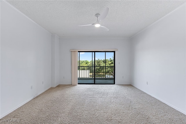 carpeted spare room featuring a textured ceiling and ceiling fan