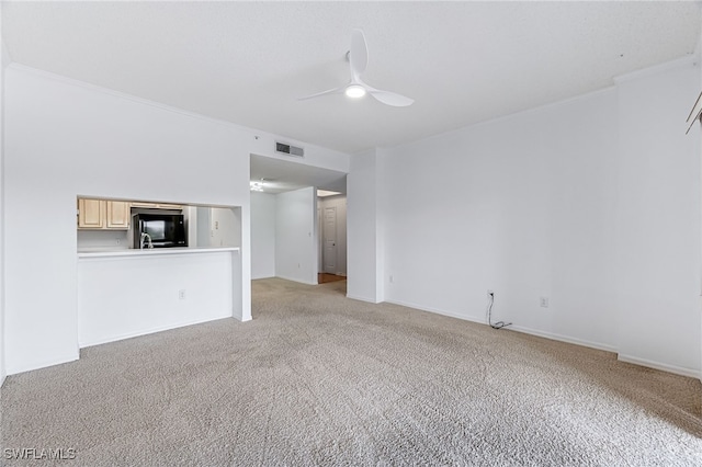 unfurnished living room featuring light carpet, baseboards, visible vents, and a ceiling fan