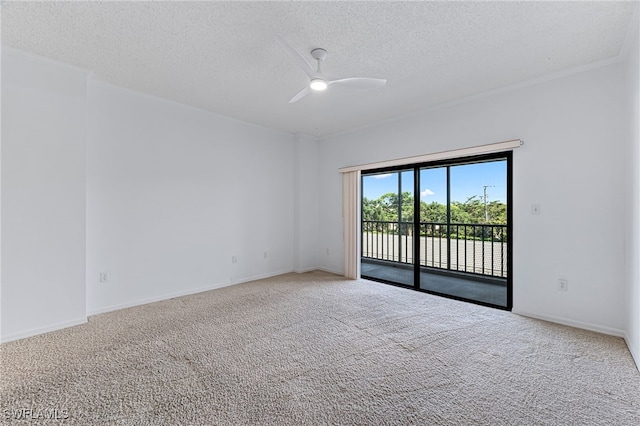 carpeted empty room featuring a textured ceiling, baseboards, and a ceiling fan