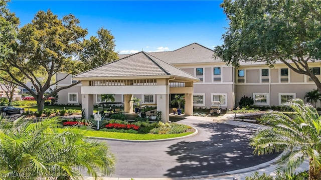 view of property with aphalt driveway