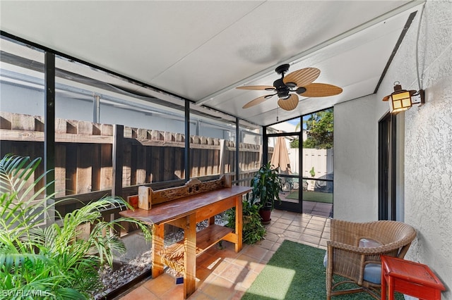 sunroom / solarium featuring ceiling fan