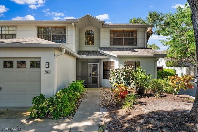 front facade with a garage