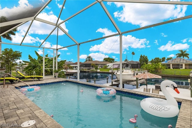 view of pool with a dock, a patio area, and a lanai