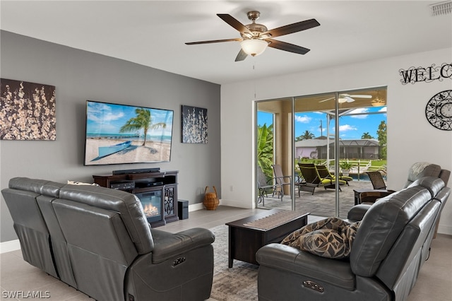 tiled living room with ceiling fan