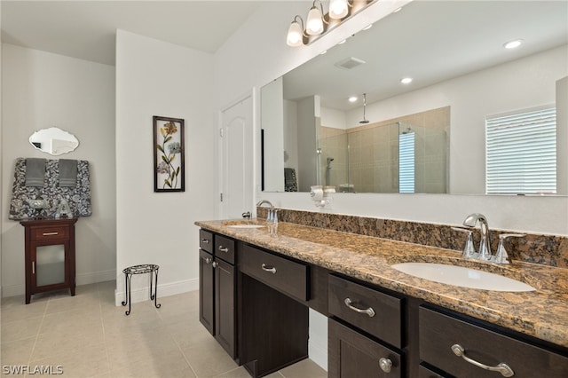 bathroom featuring tile patterned flooring, an enclosed shower, and dual bowl vanity