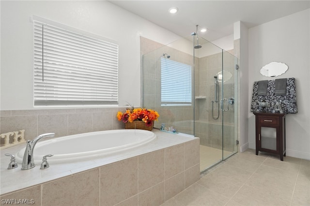 bathroom featuring shower with separate bathtub and tile patterned flooring