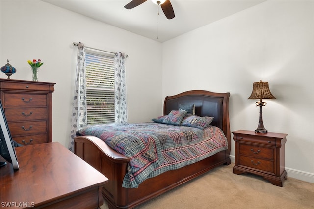 bedroom featuring light carpet and ceiling fan