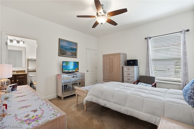 bedroom featuring ensuite bathroom, ceiling fan, and light colored carpet